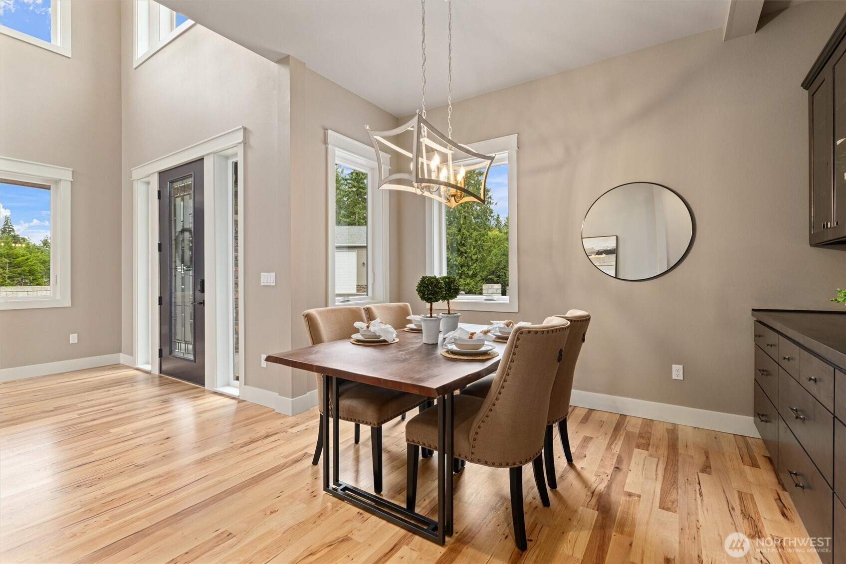 151 East Windy Ridge Lane Belfair, WA 98528 - Photo 14 of 40 a view of a dining room with furniture window and wooden floor