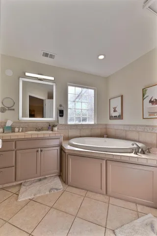 a front view of a house with swimming pool and sitting area