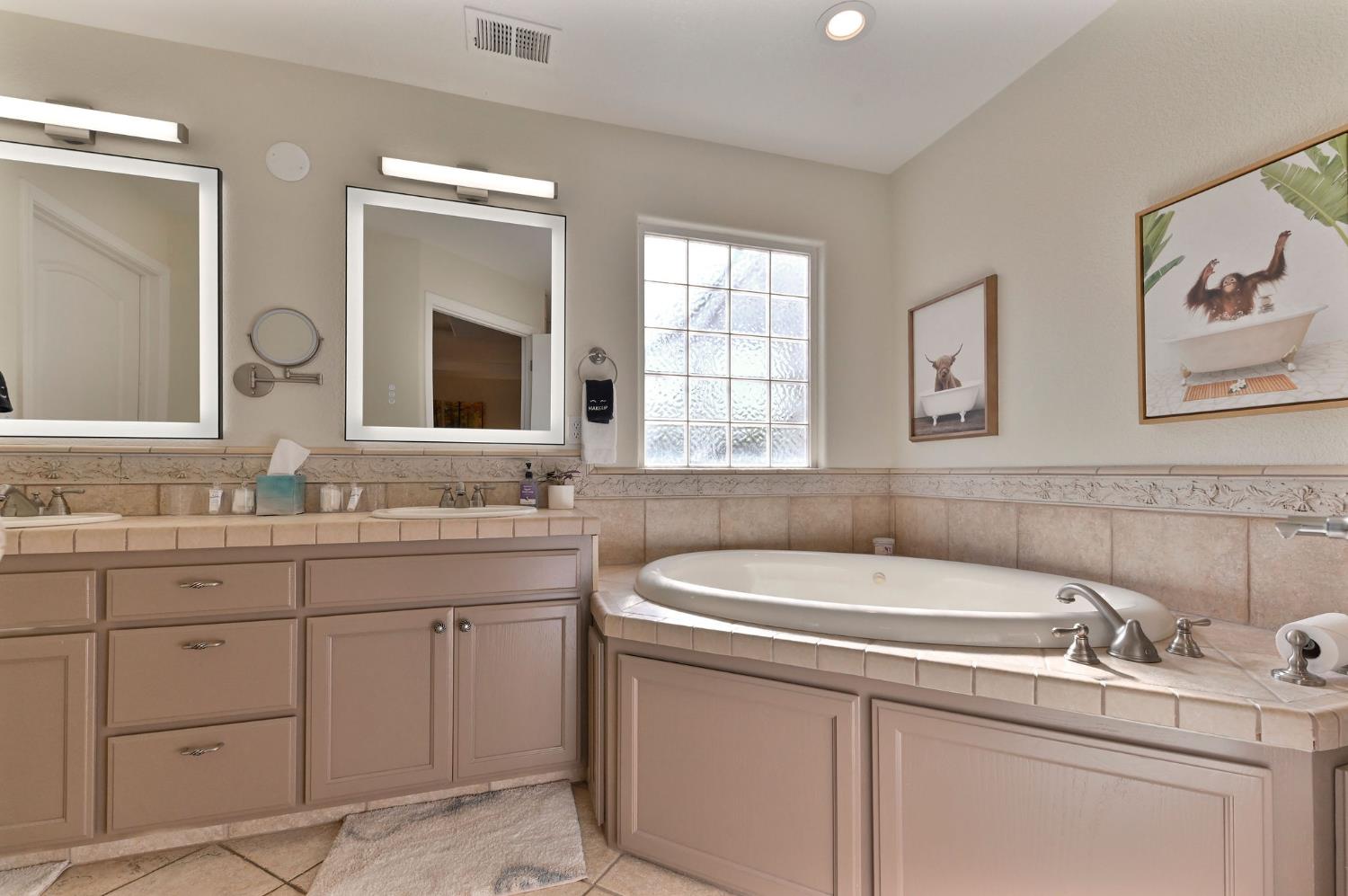 333 Oak Tree Circle Murphys, CA 95247 - Photo 33 of 88 a bathroom with a sink and a window