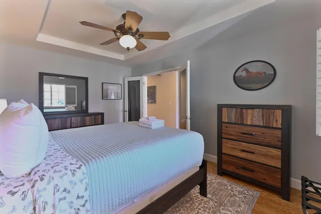 a view of a house with a yard fire pit and a patio