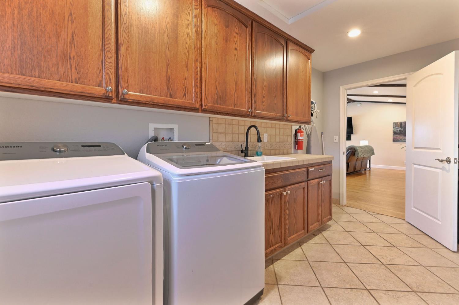 333 Oak Tree Circle Murphys, CA 95247 - Photo 49 of 88 a utility room with dryer and washer