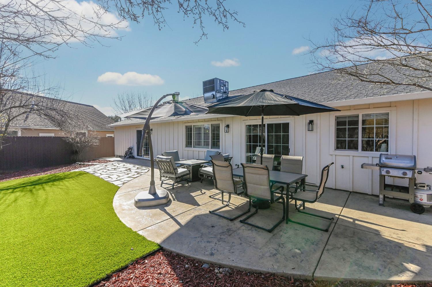 333 Oak Tree Circle Murphys, CA 95247 - Photo 52 of 88 a building outdoor space with patio furniture and potted plants