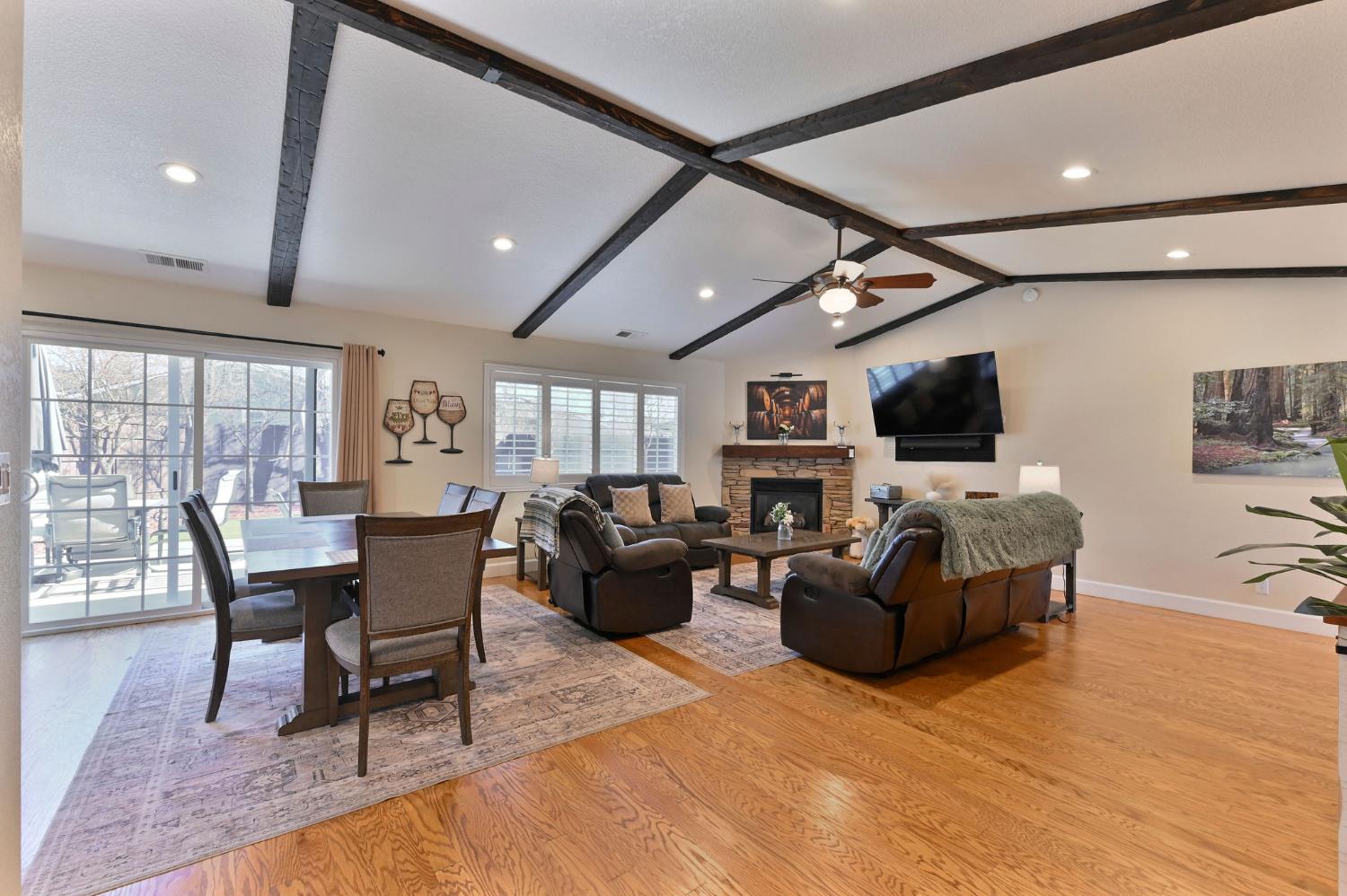 333 Oak Tree Circle Murphys, CA 95247 - Photo 6 of 88 a living room with furniture a flat screen tv and a fireplace