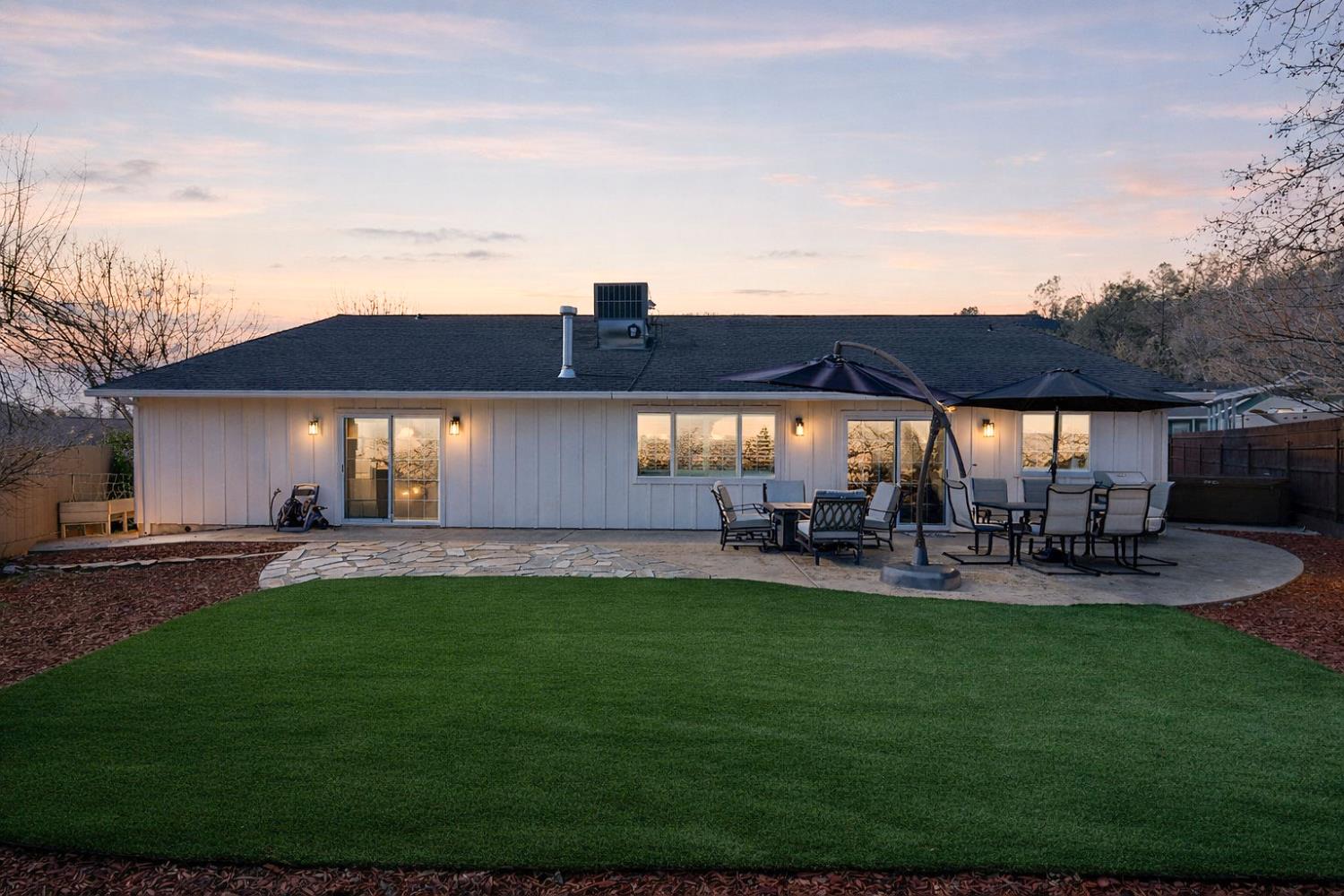 333 Oak Tree Circle Murphys, CA 95247 - Photo 85 of 88 a view of a house with a yard fire pit and a patio