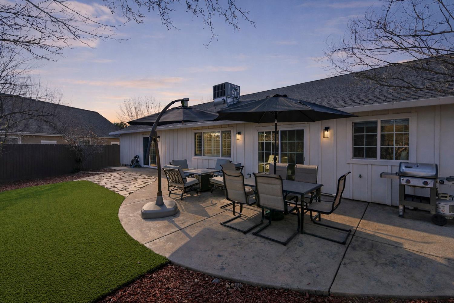 333 Oak Tree Circle Murphys, CA 95247 - Photo 87 of 88 a view of a patio with table and chairs and potted plants