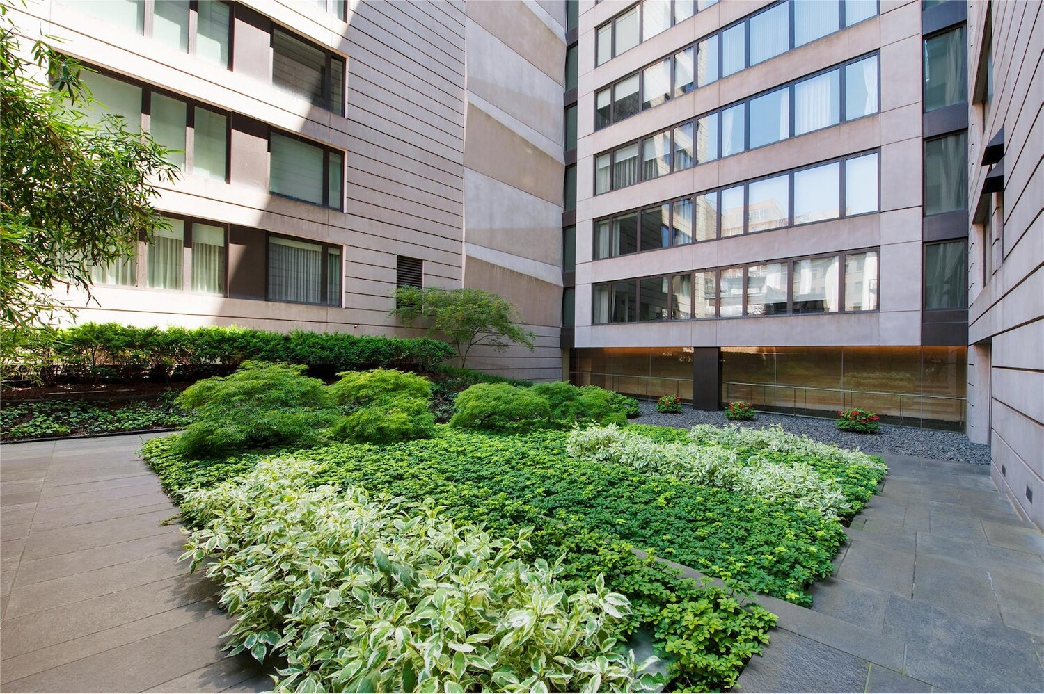 505 Greenwich Street, Unit 8AW Manhattan, NY 10013 - Photo 9 of 11 a view of a brick building next to a yard