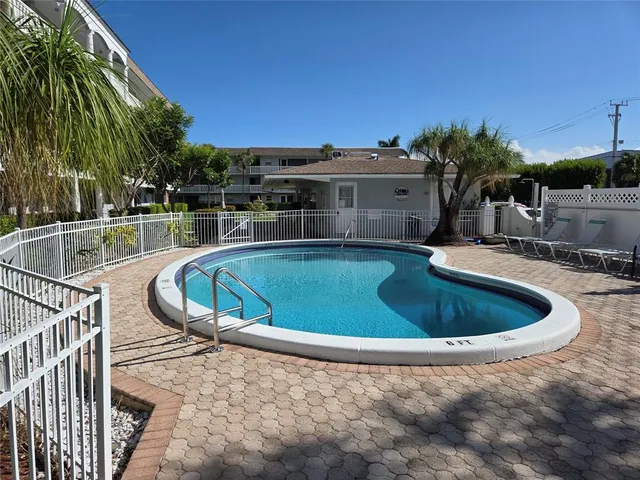 a view of a swimming pool with a patio