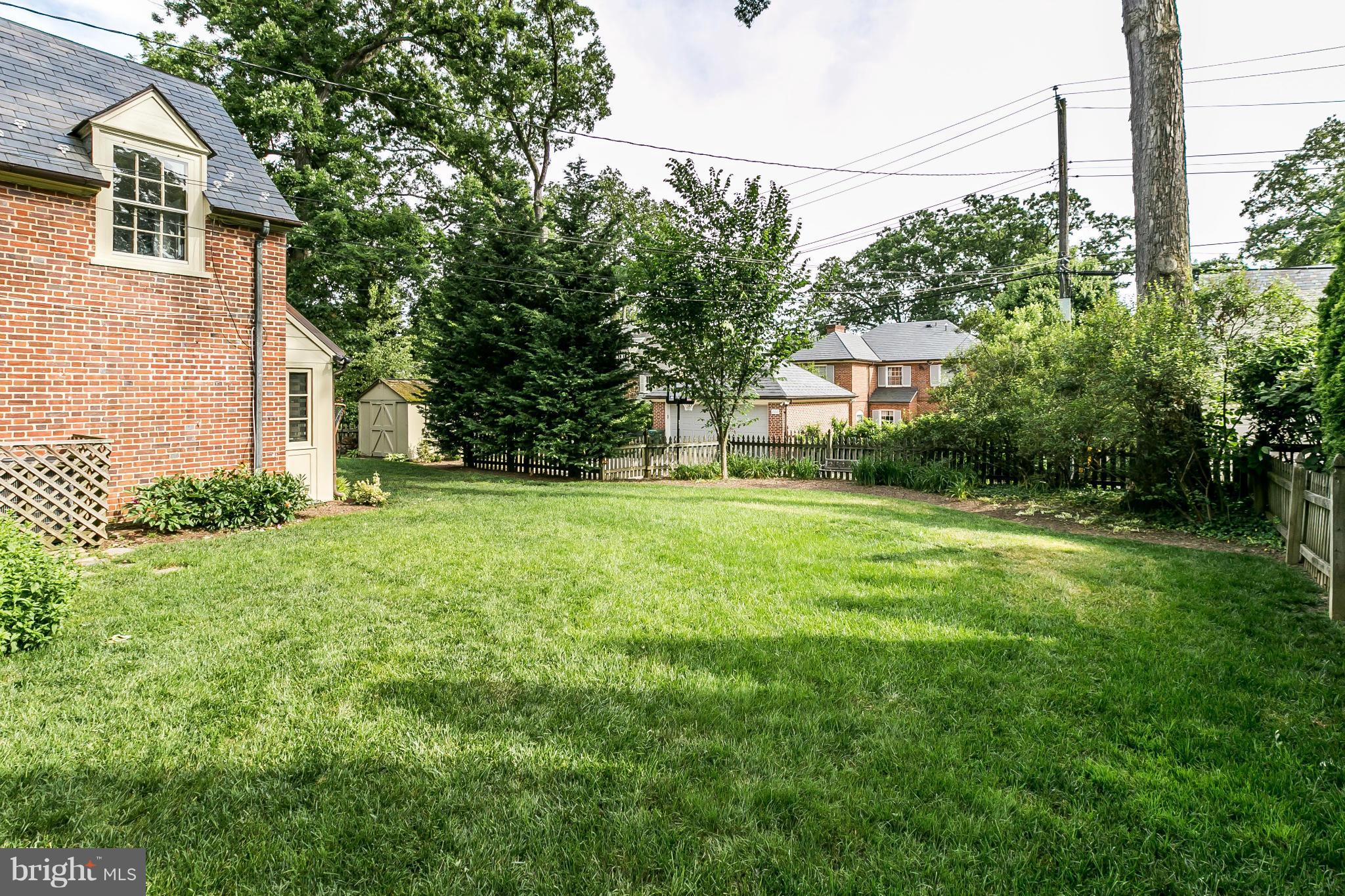 209 Upnor Road Baltimore, MD 21212 - Photo 24 of 30 Grassy lawn and landscaped garden beds