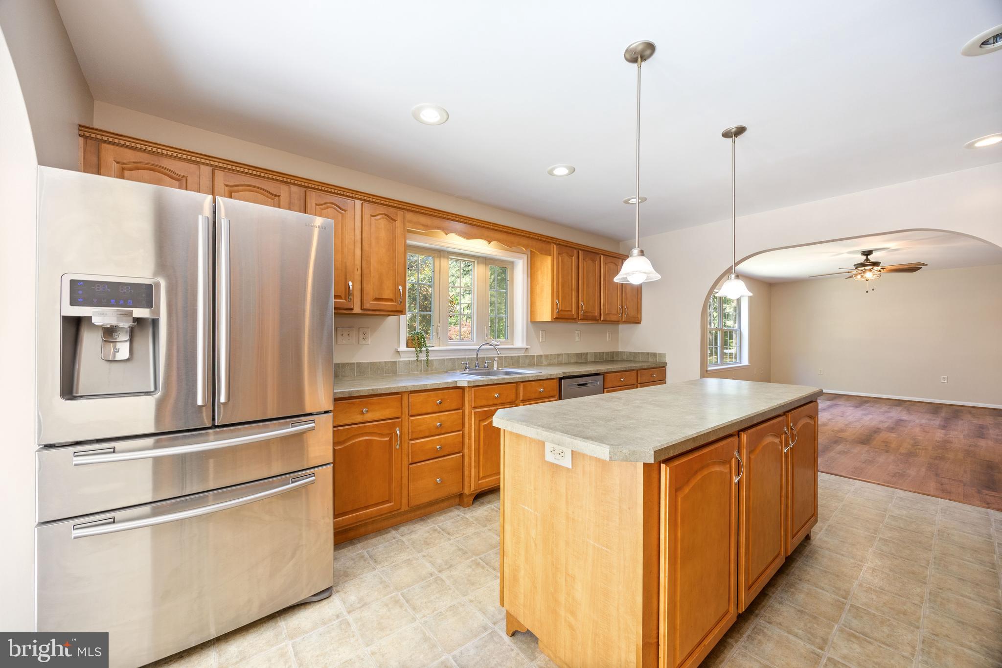 6635 Libertytown Road Berlin, MD 21811 - Photo 16 of 88 a kitchen with stainless steel appliances granite countertop a sink stove and refrigerator
