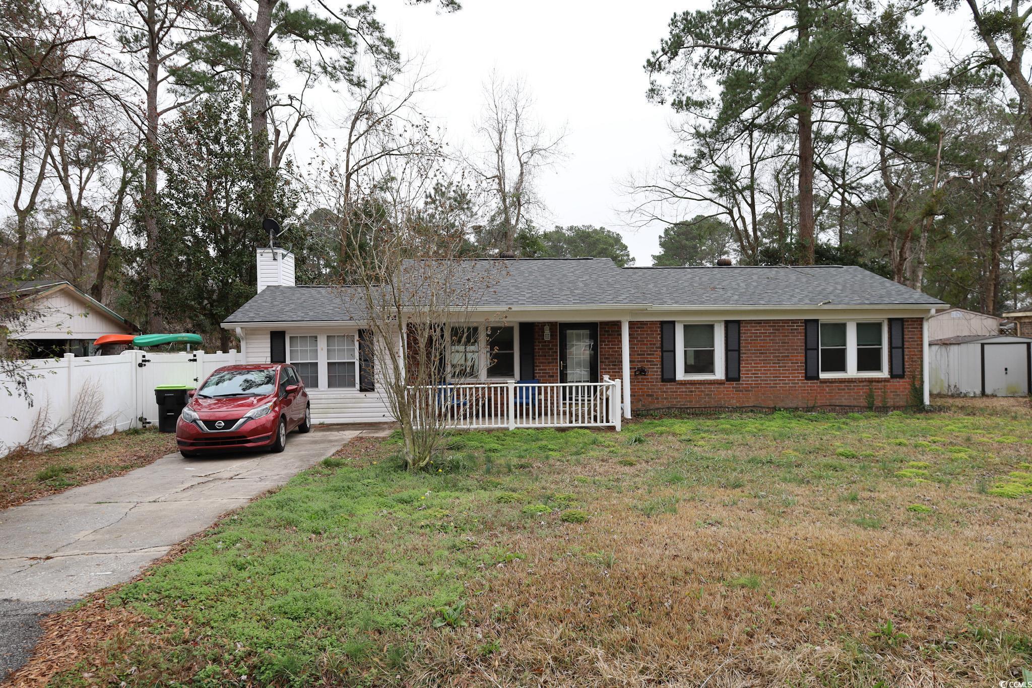 4649 Tarpon Bay Road Myrtle Beach, SC 29579 - Photo 1 of 24 Ranch-style house with a storage unit, covered por