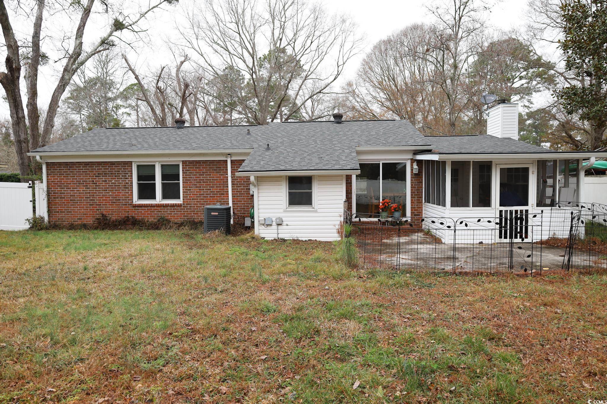 4649 Tarpon Bay Road Myrtle Beach, SC 29579 - Photo 21 of 24 Back of house with a patio, a sunroom, central AC,