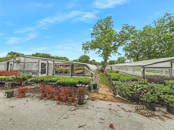 a view of a outdoor space with deck and yard