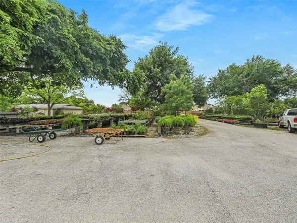 a backyard of a house with a yard and outdoor seating