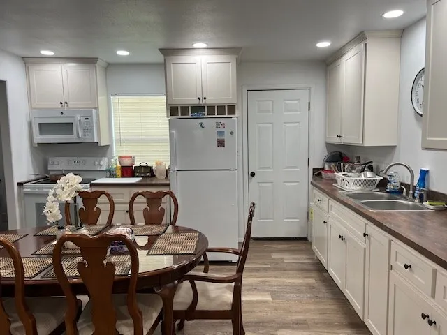 a bedroom with a bed and a tv