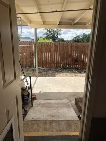 a view of a garage with cars