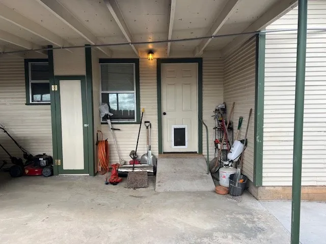 a view of backyard with tub and outdoor seating