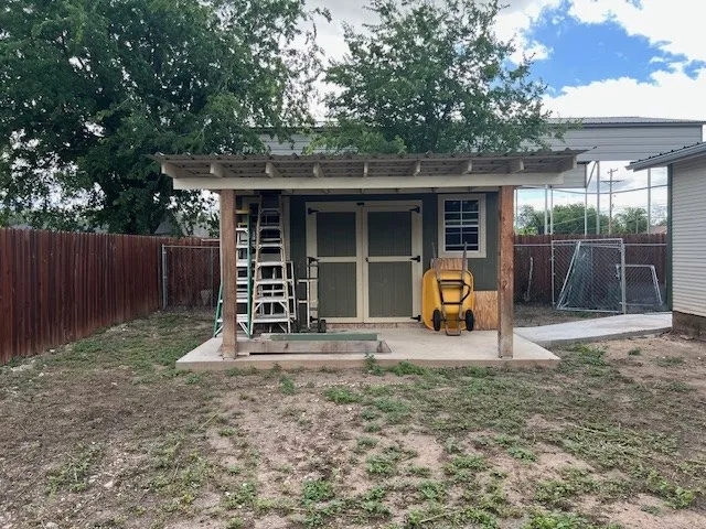 a house view with a backyard space