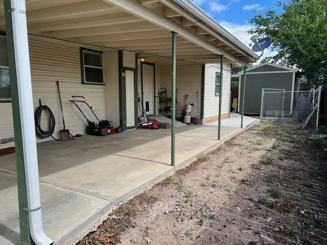 a view of a porch with wooden floor and outdoor space