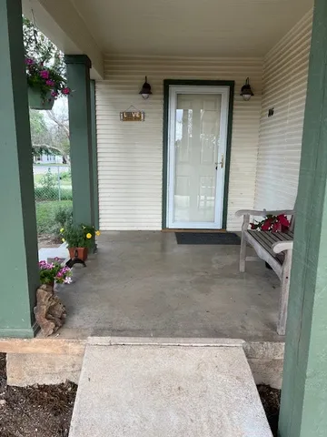 a living room with furniture flat screen tv and a fireplace