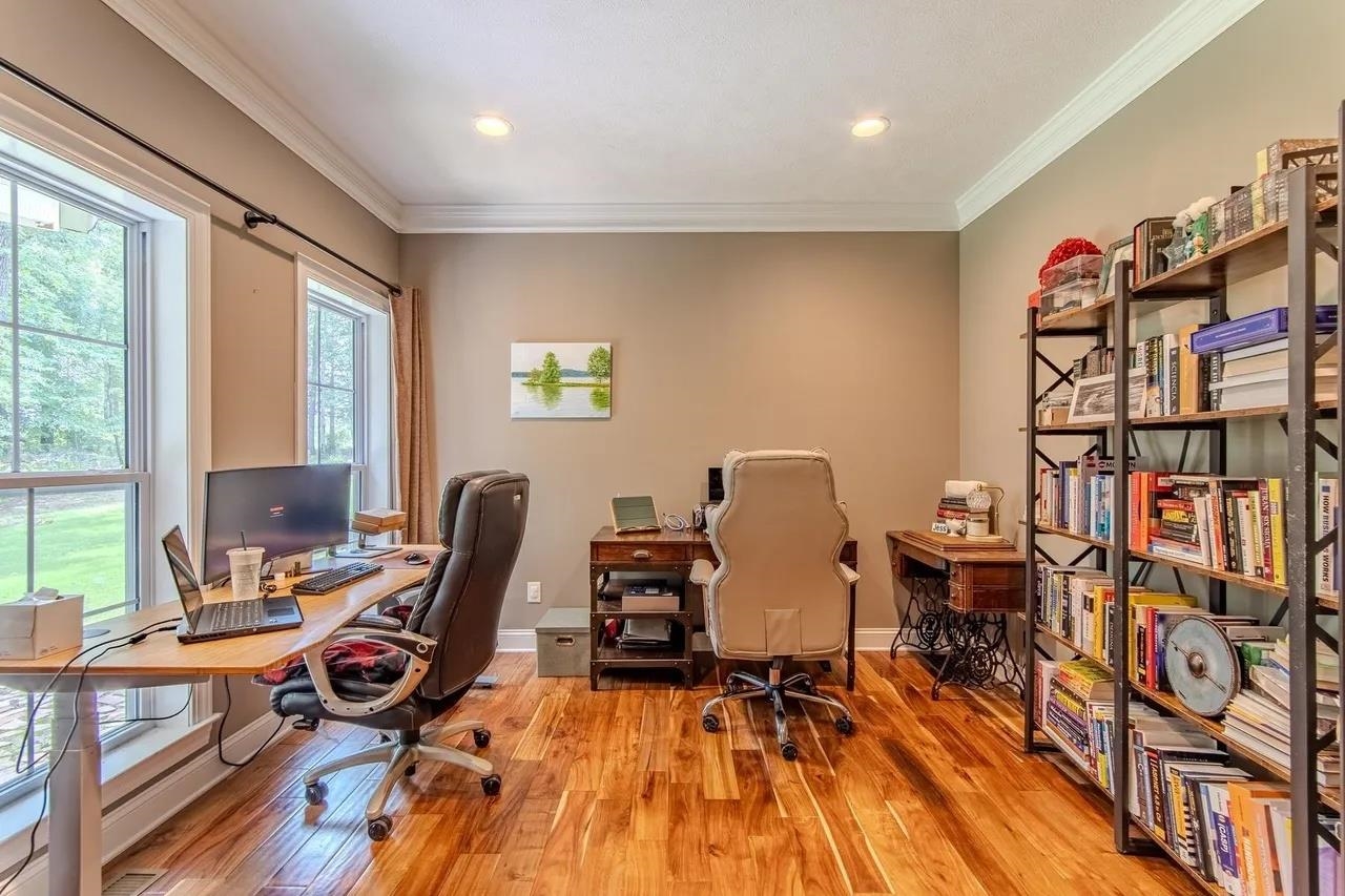 2134 Otis Plunk Road Bethel Springs, TN 38315 - Photo 16 of 35 a view of a workspace with furniture and a wooden floor