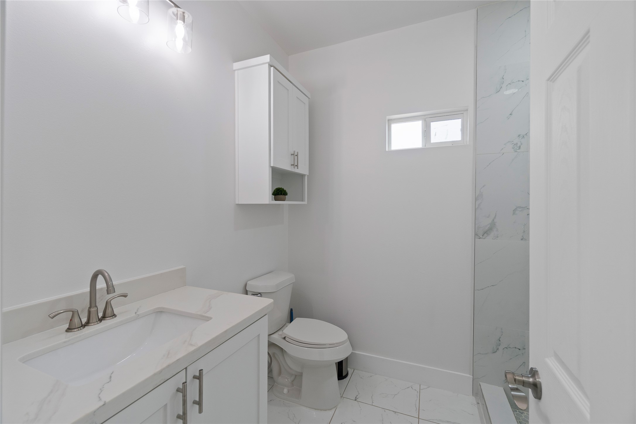 23232 Val Verde Edcouch, TX 78538 - Photo 8 of 19 a bathroom with a toilet sink vanity and mirror
