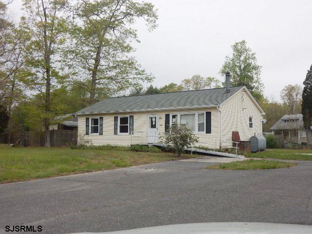 41 Mill Road Woodbine, NJ 08270 - Photo 1 of 1 a view of a house with a big yard and large trees