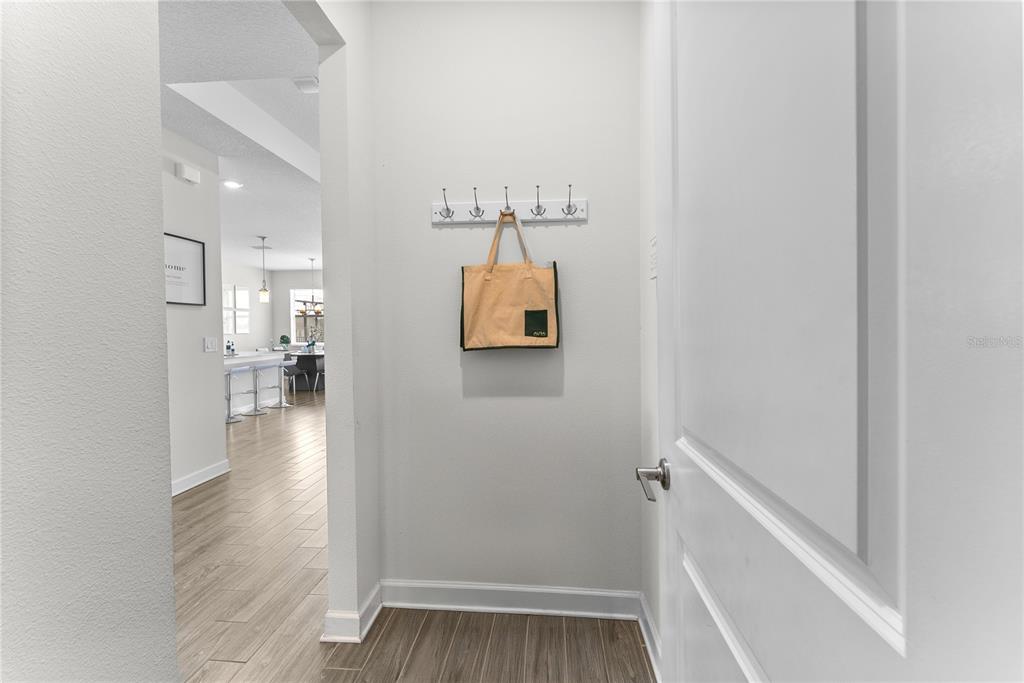 2926 Wordsmith Road Kissimmee, FL 34746 - Photo 38 of 42 a view of a hallway with wooden floor and staircase