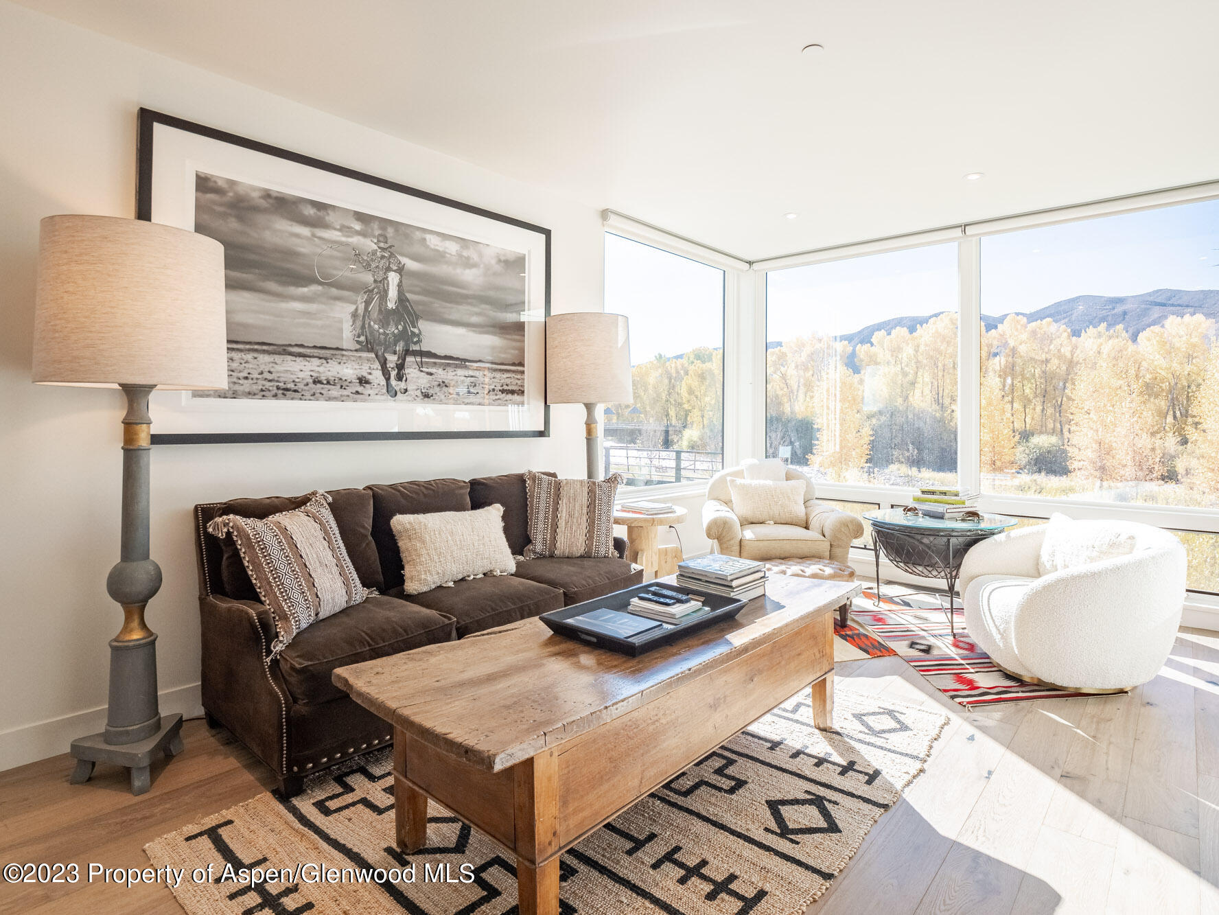 22858 Two Rivers Road Basalt, CO 81621 - Photo 14 of 40 a living room with furniture and a large window