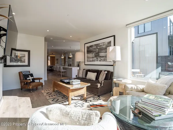 a living room with furniture and a table