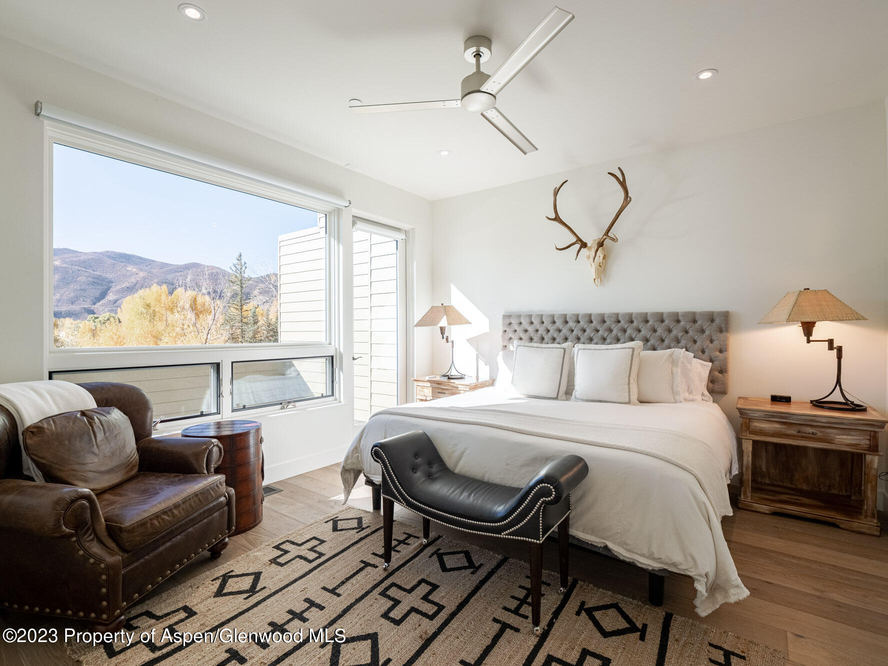 22858 Two Rivers Road Basalt, CO 81621 - Photo 24 of 40 a bedroom with furniture and a large window