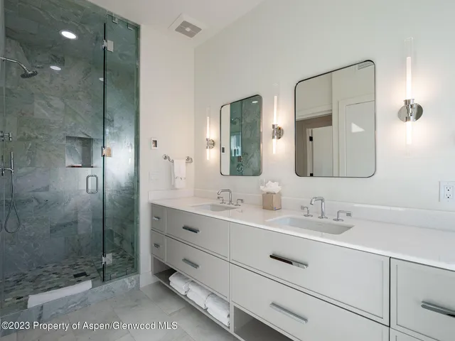 a view of a room with wooden floor and a hallway