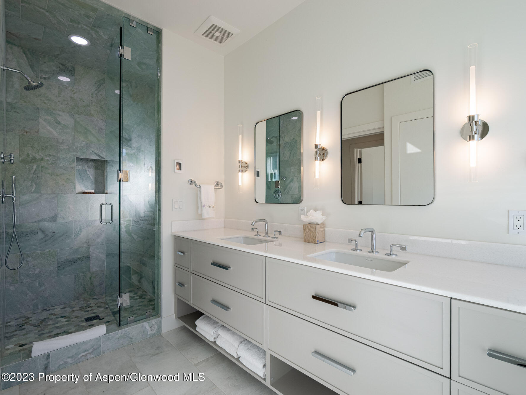 22858 Two Rivers Road Basalt, CO 81621 - Photo 28 of 40 a bathroom with a double vanity sink mirror and shower