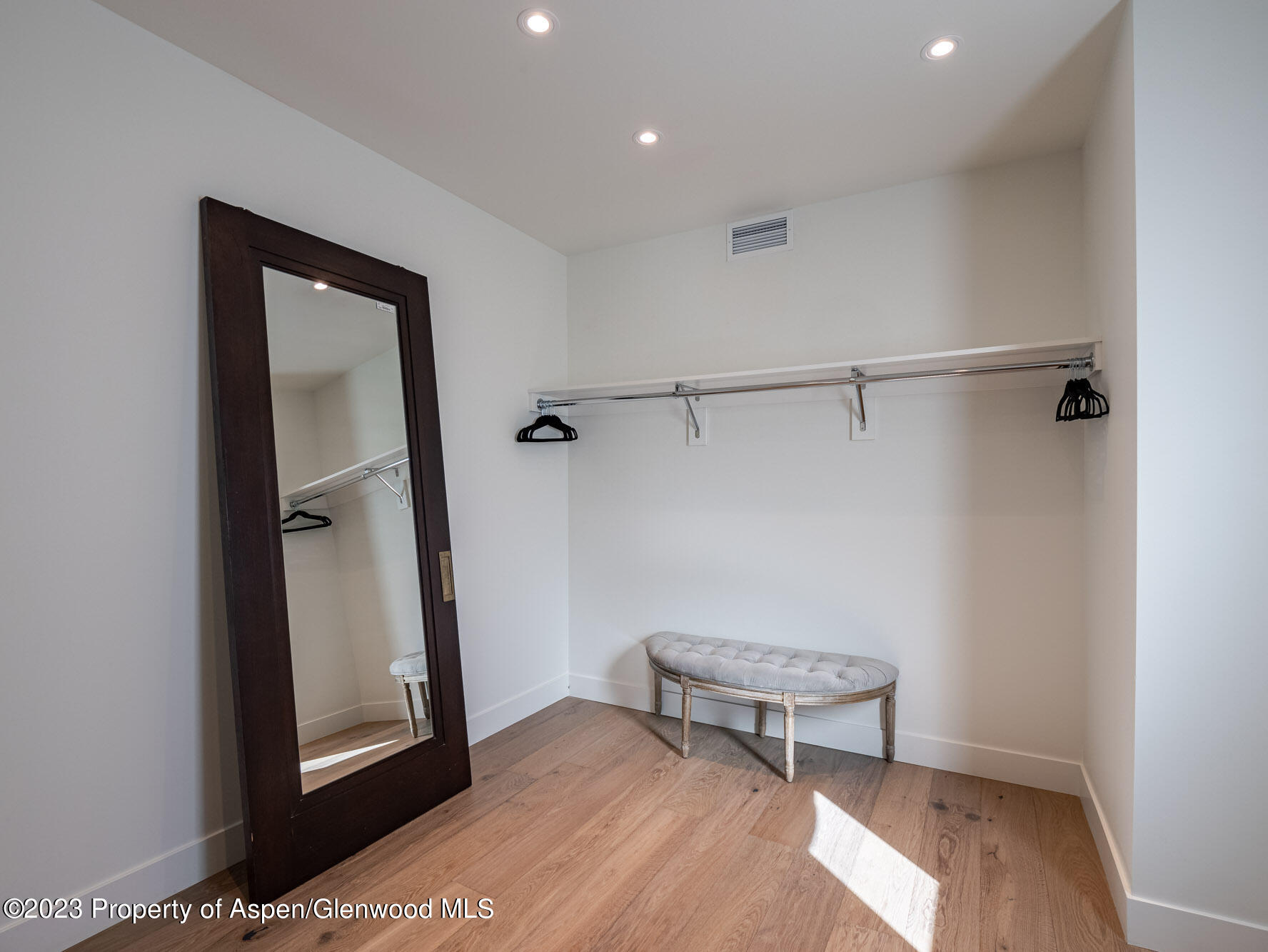 22858 Two Rivers Road Basalt, CO 81621 - Photo 29 of 40 a view of a room with wooden floor and a hallway