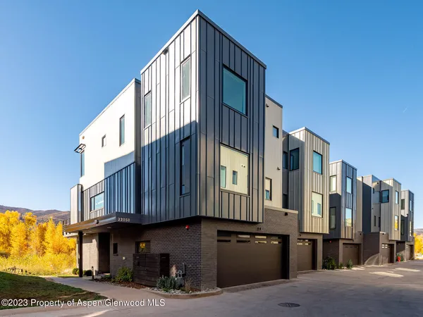 a view of a brick building with many windows