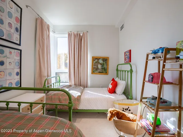 a bedroom with furniture and a bed