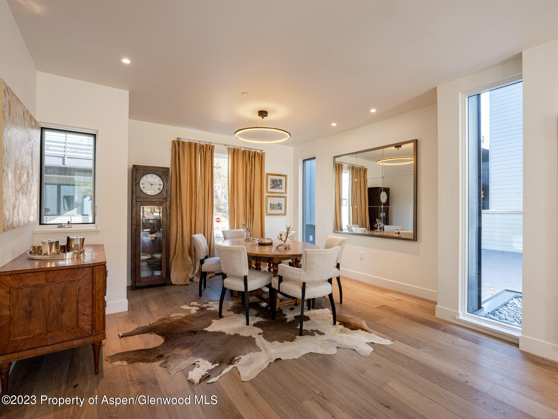 22858 Two Rivers Road Basalt, CO 81621 - Photo 6 of 40 a living room with furniture and large windows