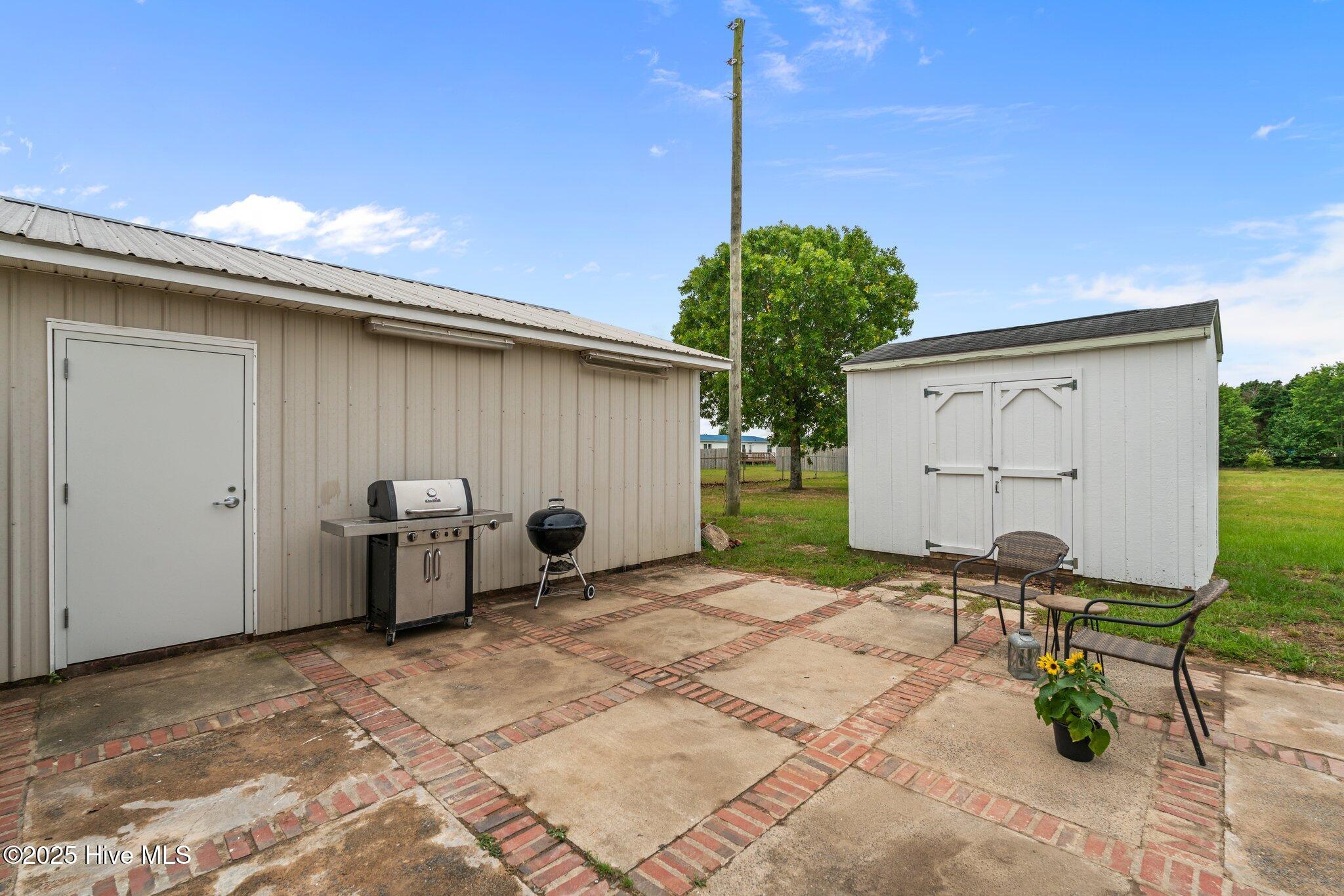 4780 Lobelia Road Vass, NC 28394 - Photo 49 of 55 storage and garage with patio