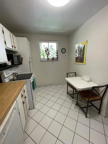a workspace with furniture and wooden floor