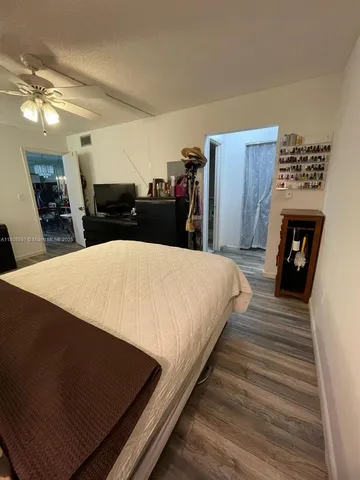 a large white bed in a kitchen