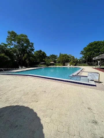 a view of swimming pool with a yard