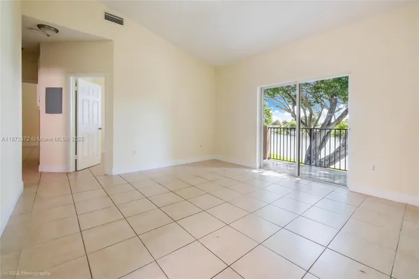 a view of an empty room and window