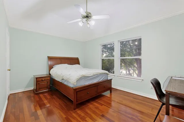 a bedroom with a bed and window