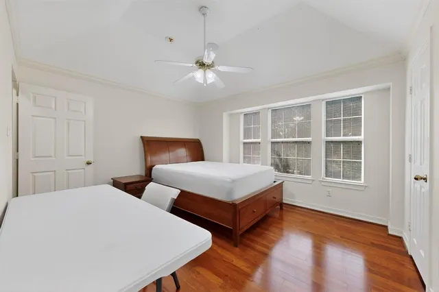 a bedroom with two beds and a window