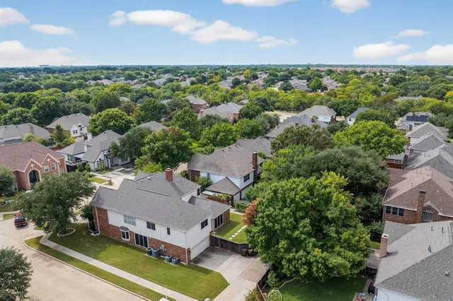 an aerial view of a house with a garden