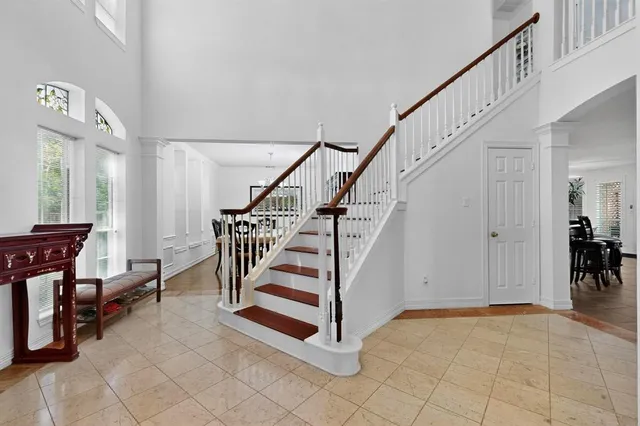 a view of entryway and hall with a front door
