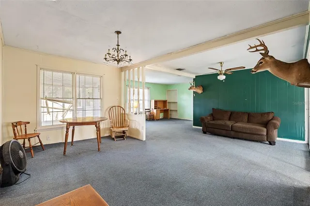 a view of a kitchen with sink and cabinets