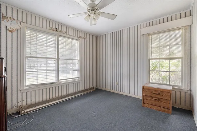 an aerial view of residential house with outdoor space and swimming pool