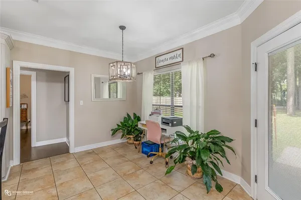 a living room with furniture and a view of kitchen