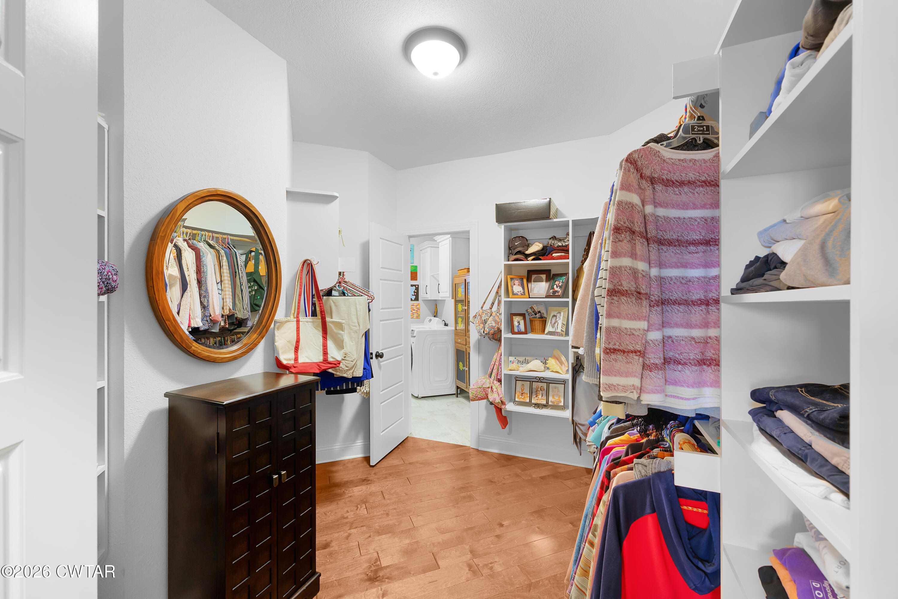 34 Cheddleton Cove Jackson, TN 38305 - Photo 13 of 32 a view of walk in closet with clothes and shoes