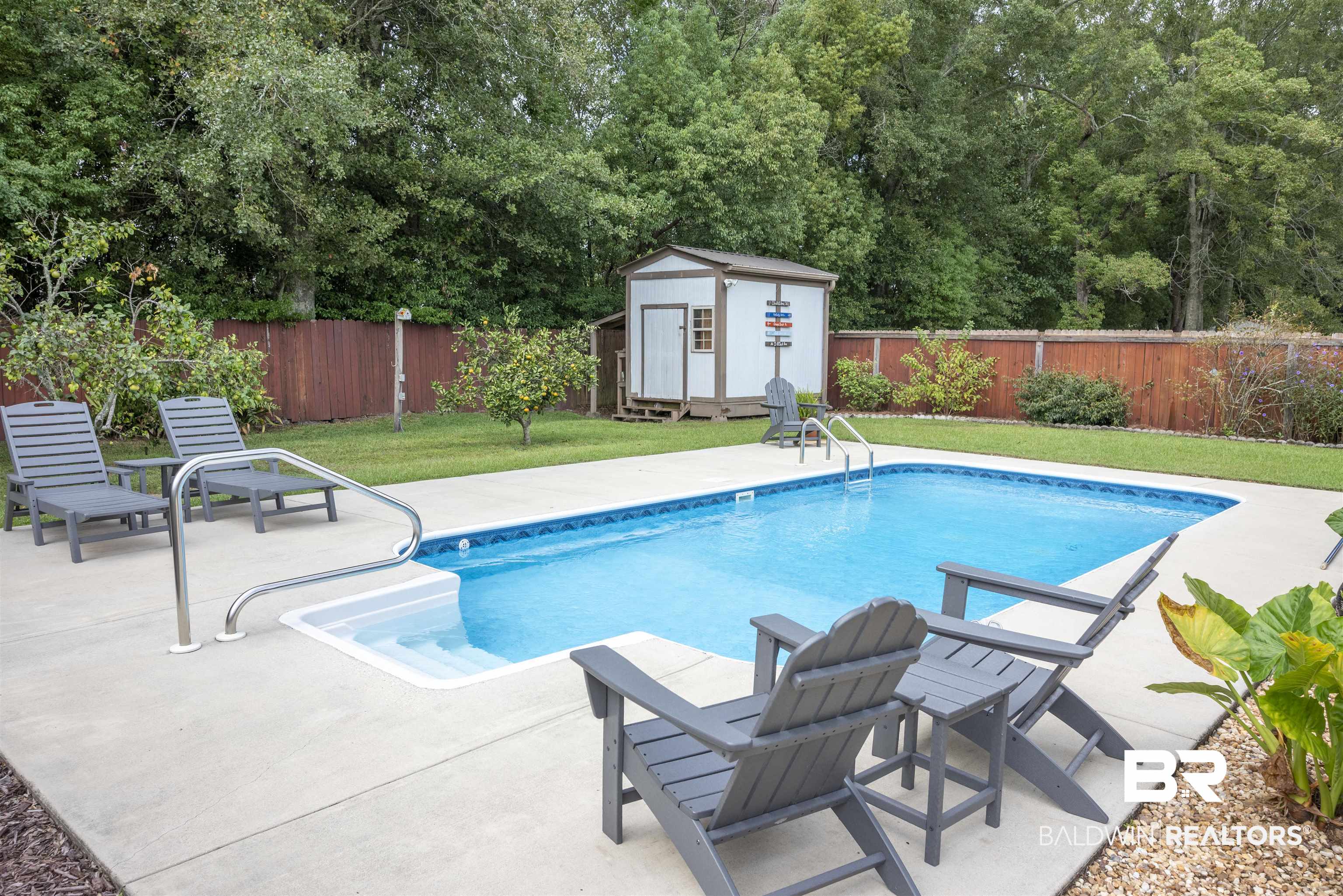 808 Wisteria Lane Foley, AL 36535 - Photo 19 of 19 View of swimming pool with a lawn, a shed, and a patio area